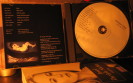 Opened CD case with booklet on the left and CD on the right